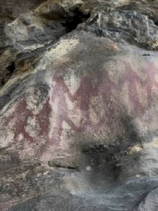 Prehistoric rock paintings on stone.
