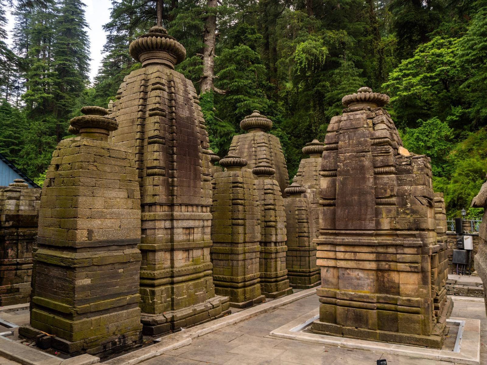 The ancient stone temples of Jageshwar Dham among the deodars.